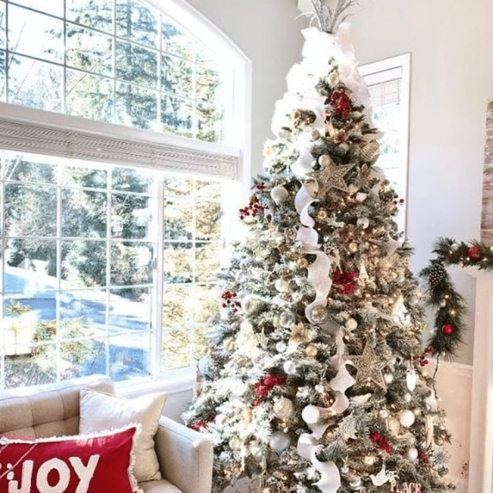Christmas Tree with white trimmings and gold decor.